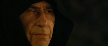 Movie still from “Kill List” (2011), directed by Ben Wheatley – An older man with a hooded jacket on; Close Up shot, Low angle