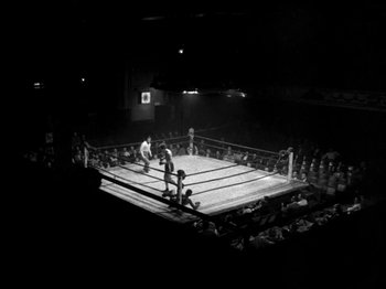 Movie still from “Killer's Kiss” (1955), directed by Stanley Kubrick – A boxing ring in a boxing ring in a boxing ring; Extreme Wide shot, High angle
