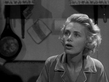 Movie still from “Killer's Kiss” (1955), directed by Stanley Kubrick – A black - and - white photo of a woman looking up; Close Up shot, Low angle