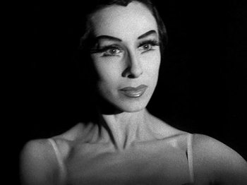 Movie still from “Killer's Kiss” (1955), directed by Stanley Kubrick – A black - and - white photo of a woman's face; Close Up shot, Low angle