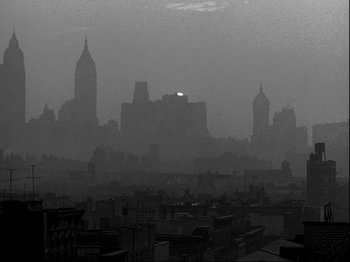 Movie still from “Killer's Kiss” (1955), directed by Stanley Kubrick – A black - and - white photo of a city skyline; Extreme Wide shot, High angle