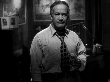 Movie still from “Killer's Kiss” (1955), directed by Stanley Kubrick – An older man in a white dress shirt and tie; Medium shot, Low angle