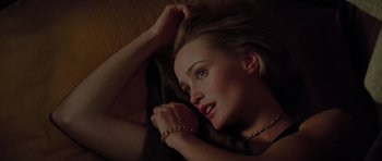 Movie still from “King Kong” (1976), directed by John Guillermin – A woman laying on the ground with her hand on her head; Close Up shot, Overhead angle