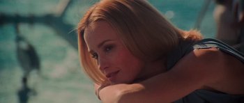 Movie still from “King Kong” (1976), directed by John Guillermin – A person with short blond hair; Close Up shot, Low angle