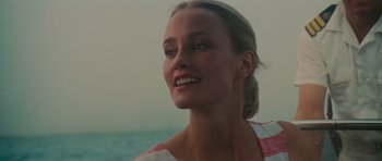 Movie still from “King Kong” (1976), directed by John Guillermin – A beautiful woman with blonde long hair and blue eyes; Close Up shot, Low angle