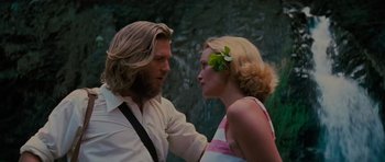 Movie still from “King Kong” (1976), directed by John Guillermin – A man and a woman standing next to each other; Close Up shot, Over the shoulder angle