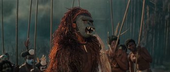 Movie still from “King Kong” (1976), directed by John Guillermin – A man with a mask on; Close Up shot, Low angle