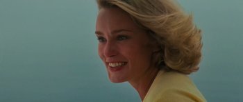 Movie still from “King Kong” (1976), directed by John Guillermin – A woman's face , smiling for the camera; Close Up shot, Low angle