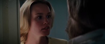 Movie still from “King Kong” (1976), directed by John Guillermin – A woman looking at her reflection in a mirror; Close Up shot, Over the shoulder angle