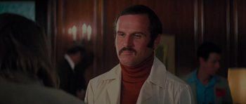 Movie still from “King Kong” (1976), directed by John Guillermin – A person wearing a jacket; Close Up shot, Low angle