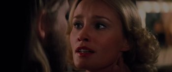 Movie still from “King Kong” (1976), directed by John Guillermin – A woman's face looking up at the sky; Close Up shot, Over the shoulder angle