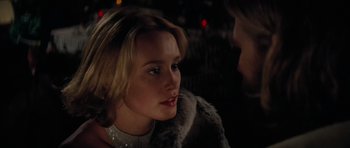 Movie still from “King Kong” (1976), directed by John Guillermin – A woman in a fur coat talking to a man in a fur coat; Close Up shot, Over the shoulder angle