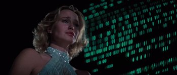 Movie still from “King Kong” (1976), directed by John Guillermin – A person crying in front of lights; Close Up shot, Low angle