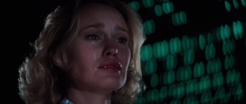 Movie still from “King Kong” (1976), directed by John Guillermin – A person with a tear in her eye; Close Up shot, Low angle