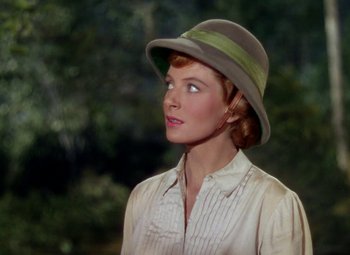 Movie still from “King Solomon's Mines” (1950), directed by Andrew Marton – A woman wearing a hat and a white shirt; Close Up shot, Over the shoulder angle