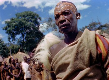 Movie still from “King Solomon's Mines” (1950), directed by Andrew Marton – A man with a beard and a towel around his neck; Close Up shot, Low angle
