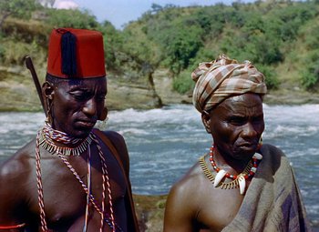 Movie still from “King Solomon's Mines” (1950), directed by Andrew Marton – A couple of men standing next to each other near a body of water; Close Up shot, Low angle