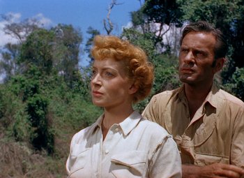 Movie still from “King Solomon's Mines” (1950), directed by Andrew Marton – A man and a woman standing next to each other in a field; Close Up shot, Low angle