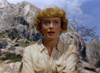 Movie still from “King Solomon's Mines” (1950), directed by Andrew Marton – A person with a mountain in the background; Close Up shot, Low angle