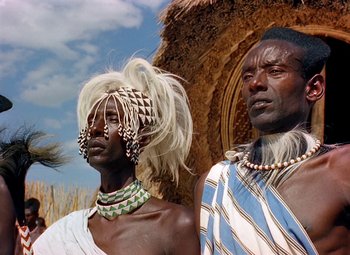 Movie still from “King Solomon's Mines” (1950), directed by Andrew Marton – A man and a woman in traditional clothing; Close Up shot, Low angle