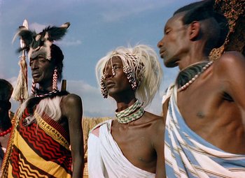 Movie still from “King Solomon's Mines” (1950), directed by Andrew Marton – A group of men standing next to each other; Medium shot, Low angle