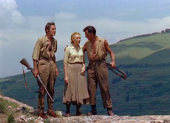 Movie still from “King Solomon's Mines” (1950), directed by Andrew Marton – A group of people standing on top of a hill; Wide shot, Low angle