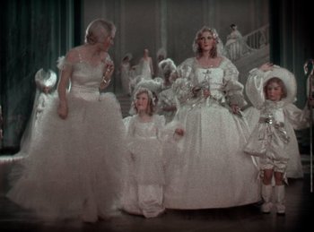 Movie still from “King of Jazz” (1930), directed by Walter Lantz – A group of people dressed up in white dresses; Wide shot, High angle