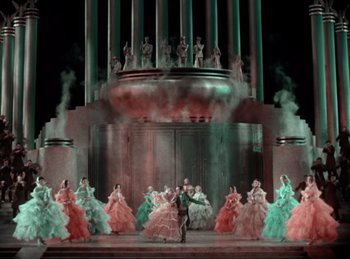 Movie still from “King of Jazz” (1930), directed by Walter Lantz – A group of people dressed in fancy gowns; Extreme Wide shot, High angle
