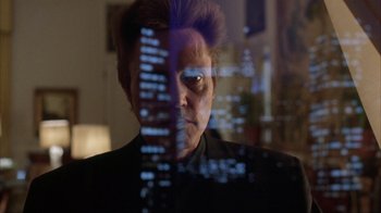 Movie still from “King of New York” (1990), directed by Abel Ferrara – A man looking at a computer screen through a window; Close Up shot, Low angle