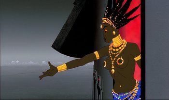 Movie still from “Kirikou and the Sorceress” (1998), directed by Raymond Burlet – An animated woman in a black and yellow outfit; Medium shot, Low angle