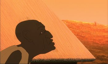 Movie still from “Kirikou and the Sorceress” (1998), directed by Raymond Burlet – An animation of an african man looking at a pyramid; Extreme Close Up shot, Low angle