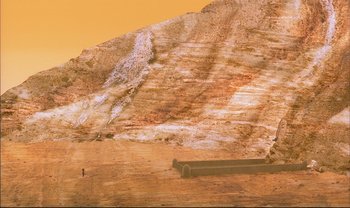 Movie still from “Kirikou and the Sorceress” (1998), directed by Raymond Burlet – An image of an image of a mountain that has been cut in half; Extreme Wide shot, High angle