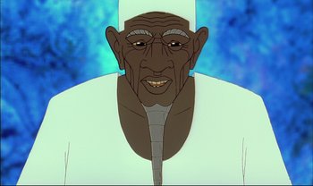 Movie still from “Kirikou and the Sorceress” (1998), directed by Raymond Burlet – An old man is wearing a white shirt and a white hat; Close Up shot, Low angle