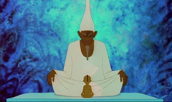 Movie still from “Kirikou and the Sorceress” (1998), directed by Raymond Burlet – An image of an animated character sitting in a yoga pose; Medium shot, Low angle