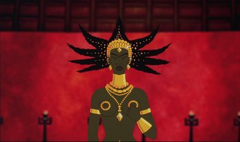 Movie still from “Kirikou and the Sorceress” (1998), directed by Raymond Burlet – An animated woman wearing a headdress and a necklace; Medium shot, Overhead angle