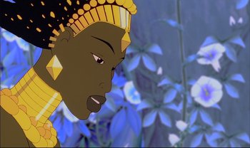 Movie still from “Kirikou and the Sorceress” (1998), directed by Raymond Burlet – An animated woman in a yellow and black dress; Close Up shot, Low angle