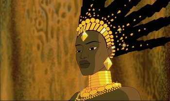 Movie still from “Kirikou and the Sorceress” (1998), directed by Raymond Burlet – An african woman wearing a golden headdress and necklace; Close Up shot, Low angle