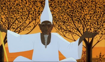 Movie still from “Kirikou and the Sorceress” (1998), directed by Raymond Burlet – An animated character in a white outfit and a white hat; Medium shot, High angle