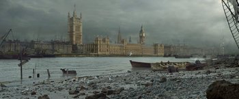 Movie still from “Enola Holmes 2” (2022), directed by Harry Bradbeer – A view of a river with a boat in the water; Extreme Wide shot, High angle