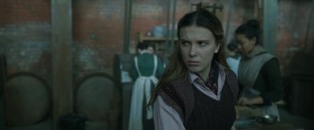 Movie still from “Enola Holmes 2” (2022), directed by Harry Bradbeer – A woman standing next to another woman in a room; Close Up shot, Over the shoulder angle