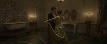 Movie still from “Enola Holmes 2” (2022), directed by Harry Bradbeer – A man and a woman dressed in formal wear; Medium shot, Low angle