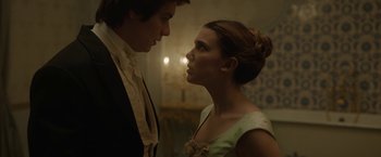 Movie still from “Enola Holmes 2” (2022), directed by Harry Bradbeer – A man and a woman standing next to each other; Close Up shot, Low angle