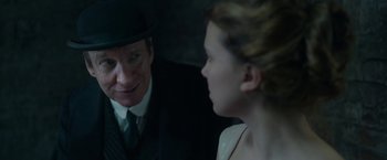 Movie still from “Enola Holmes 2” (2022), directed by Harry Bradbeer – A man and a woman talking to each other; Close Up shot, Over the shoulder angle