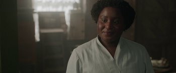 Movie still from “Enola Holmes 2” (2022), directed by Harry Bradbeer – A woman wearing a white shirt is looking at the camera; Close Up shot, Over the shoulder angle