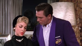 Movie still from “Kiss Me Kate” (1953), directed by George Sidney – A man and a woman are looking at one another; Medium shot, Over the shoulder angle