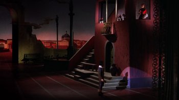 Movie still from “Kiss Me Kate” (1953), directed by George Sidney – A stage set with stairs and steps leading up to a balcony; Extreme Wide shot, High angle