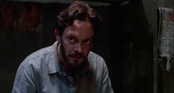 Movie still from “Kiss of the Spider Woman” (1985), directed by Hector Babenco – A person wearing a shirt; Close Up shot, High angle