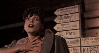 Movie still from “Kiss of the Spider Woman” (1985), directed by Hector Babenco – A woman with her hands over her chest; Close Up shot, Low angle