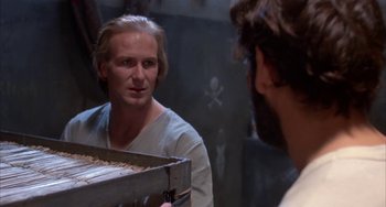 Movie still from “Kiss of the Spider Woman” (1985), directed by Hector Babenco – A man is looking at himself in the mirror; Close Up shot, Over the shoulder angle