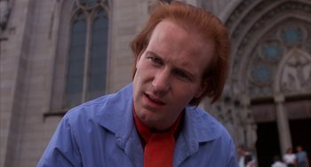 Movie still from “Kiss of the Spider Woman” (1985), directed by Hector Babenco – A person wearing a shirt and tie; Close Up shot, Low angle